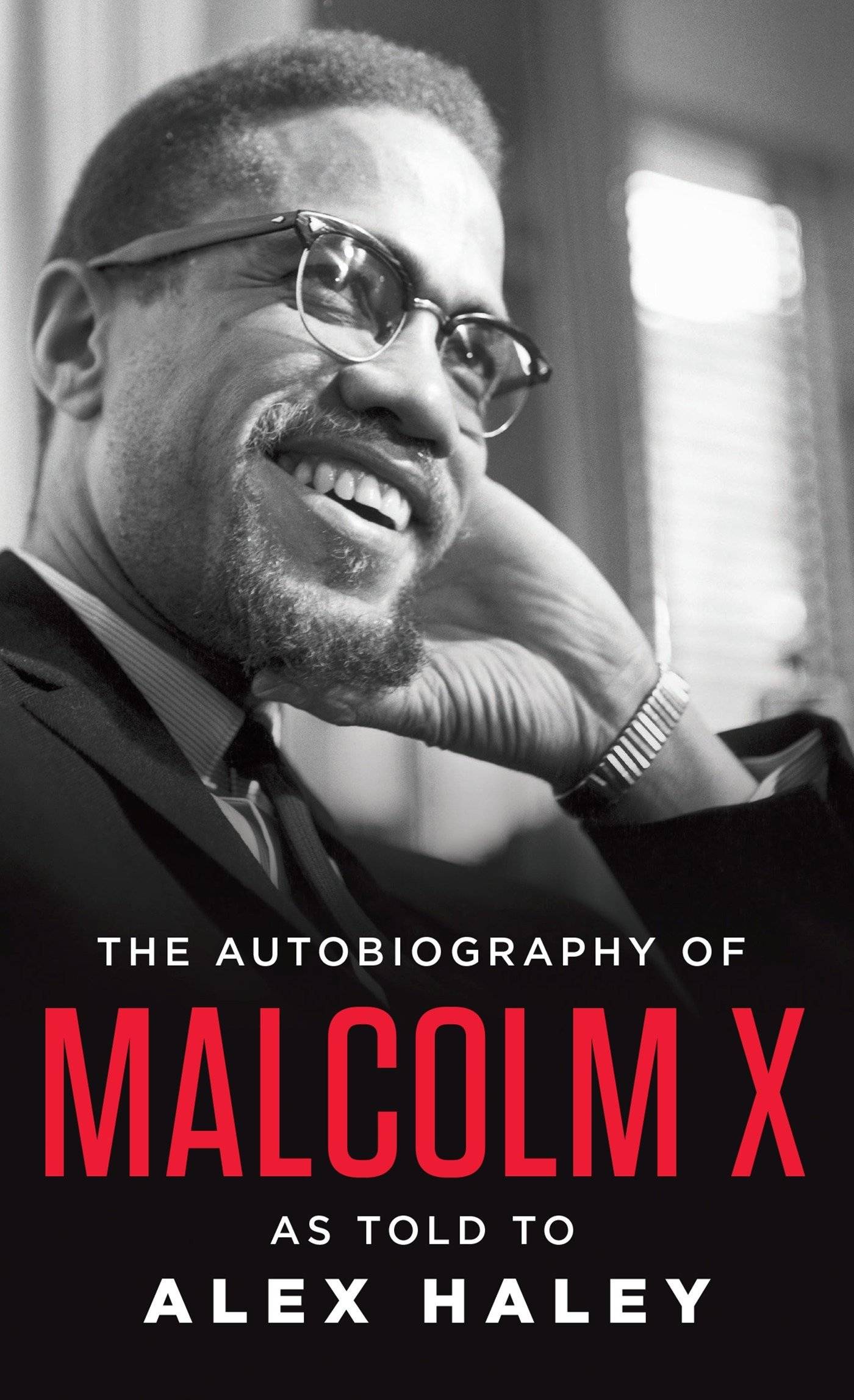 Book cover with a black and white photo of a smiling Malcolm X
